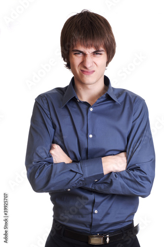 Photo: Angry young Businessman watch in camera isolated on white backgr Angry young Businessman watch in camera isolated on white backgr