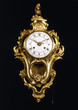Foto: Old-fashion golden clock with pendulum Old-fashion golden clock with pendulum
