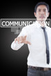 Businessman pushing Communication word on the whiteboard.