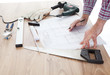 Worker looking into a house plan