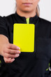 referee showing the yellow card