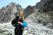 Woman after climbing the peak of the mountain