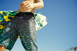 male surfer walking with surfboard on the beach sunny day