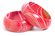 Two Pink Wooden Bangles on White Background