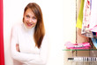 Young woman inside a store buying clothes