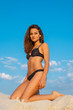 Beautiful woman posing on sand