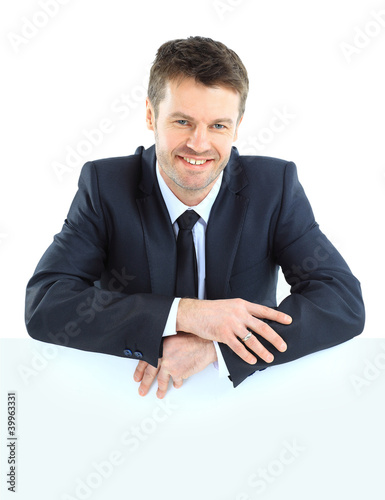 Photo: Happy smiling business man showing blank Happy smiling business man showing blank