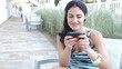 Video: Beautiful brunette woman sending text message on vacation Beautiful brunette woman sending text message on vacation