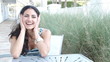 Happy multi ethnic woman smiling and laughing portrait