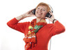 Foto: Aktive Frau (64 Jahre) geniesst Musik mit Kopfhörer Aktive Frau (64 Jahre) geniesst Musik mit Kopfhörer