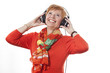 Foto: Aktive Frau (64 Jahre) geniesst Musik mit Kopfhörer Aktive Frau (64 Jahre) geniesst Musik mit Kopfhörer