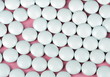 white pill on pink background