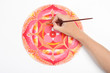 man hand painting abstract red picture with circle pattern, mand