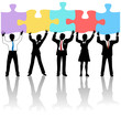 Business people team hold puzzle solution