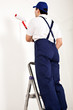 Painter man with paint roller
