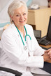 American female doctor sitting at desk