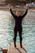 Foto: Happy Woman Standing On A Pier Happy Woman Standing On A Pier
