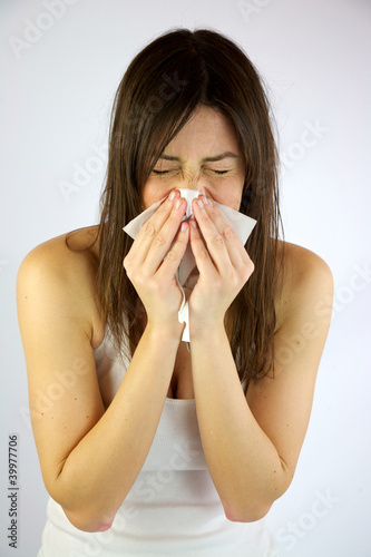 Photo: Very sick girl sneezing Very sick girl sneezing