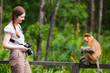 Female photographer and proboscis monkey