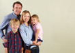 Studio Shot Of Relaxed Family