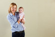 Studio Shot Of Happy Mother and Baby