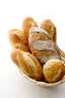 Foto: many baguettes in basket on white background many baguettes in basket on white background