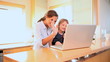 A mother and daughter in a video call on the laptop