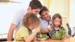 Family mixing lettuce