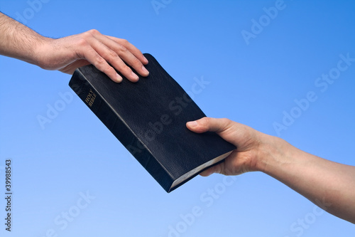 Photo: Hand Giving Bible Hand Giving Bible