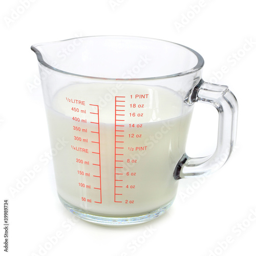 Photo: Milk in measuring cup Milk in measuring cup