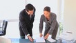 Business people signing a contract