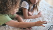 Children lying on the carpet