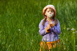 girl with a dandelion in the hands of