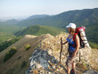 The magnificent landscape opens to a woman who stands on the top