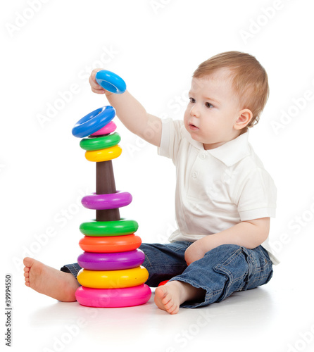 Photo: child playing with color pyramidion child playing with color pyramidion
