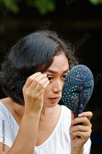 Photo: young woman picking eyebrow young woman picking eyebrow