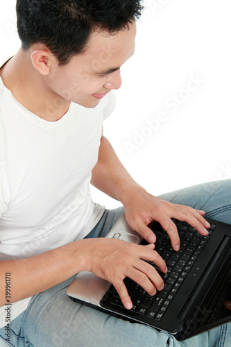 Photo: man using laptop man using laptop