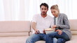 Couple eating popcorn while watching a movie