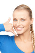 woman making a call me gesture