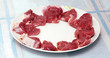 Fresh meat on the white plate