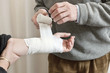 Photo: Doctor Applying Bandage On Injured Hand Doctor Applying Bandage On Injured Hand