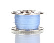 Metal spool of thread isolated on white