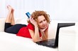 Girl dreaming about online shopping