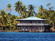 Stilt house and sea