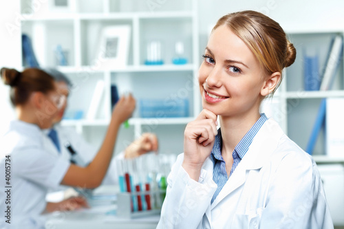 Photo: Young scientists working in laboratory Young scientists working in laboratory