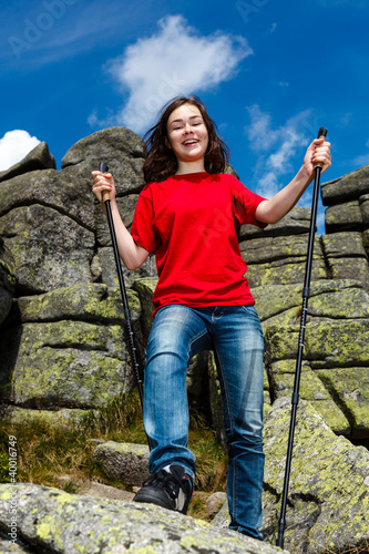 Photo: Nordic walking - active girl outdoor Nordic walking - active girl outdoor