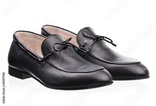 Photo: Pair of elegant male shoes over white background Pair of elegant male shoes over white background