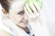 portrait of young woman with apple