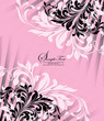 pink invitation card with floral elements