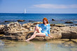 Greece. Rhodes.The young beautiful woman on seacoast... Greece. Rhodes.The young beautiful woman on seacoast...